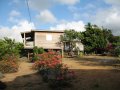 Big Sky Lodge Guesthouses, surrounded by tropical plants